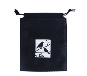 Close-up of black non-woven drawstring bag featuring a white bird silhouette print