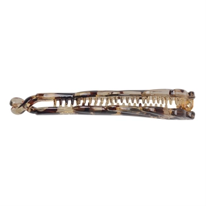 Detail view of tortoiseshell banana hair clip with durable resin teeth and spring clasp