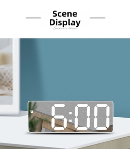 Detail of minimalist LED mirror alarm clock with white casing and digital 6:00 display