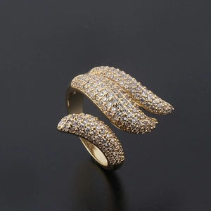 Golden open feather ring with micro-pave clear cubic zirconia stones on black background