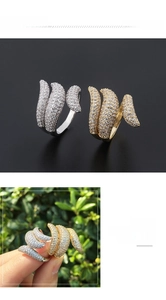 Adjustable pavé set feather ring in gold and silver finish with sparkling zircons