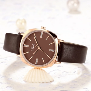 Elegant thin rose gold watch for women with brown leather strap and diamond dial markers