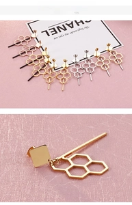 Detailed close-up of geometric honeycomb tassel earrings in multiple metallic finishes