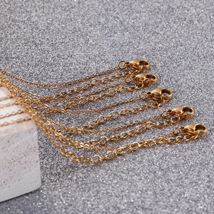 Set of five gold titanium steel extension chains with lobster clasps for necklaces