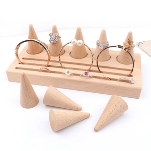 Minimalist wooden jewelry display set with rectangular base and conical ring holders