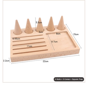 Macro detail of natural beech wood jewelry display tray with dimensions and five ring cones