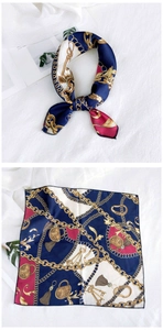 Detail view of retro chain print silk square scarf in navy, burgundy and beige tones