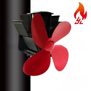 Detail of red 4-blade heat powered stove fan with black aluminum base and metal clamp
