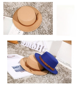 Detailed top view of wool boater hats in khaki and blue with leather bands
