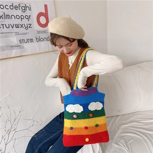 Detailed knit shoulder bag with rainbow stripes and 3D white cloud ornament