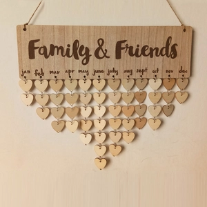 Detail of wooden Family & Friends birthday tracker with heart tags and metal rings