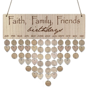 Close-up of wooden birthday calendar plaque with hanging heart and round wood tags