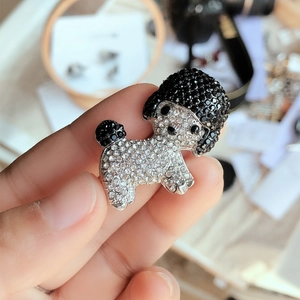 Sparkling poodle brooch with black and white crystals in a silver-tone setting