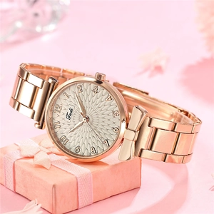 Rose gold women's steel watch with textured dial and butterfly bow case design
