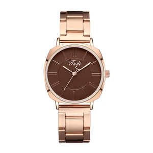 Detail of rose gold stainless steel watch with deep brown dial and Tadi logo engraving
