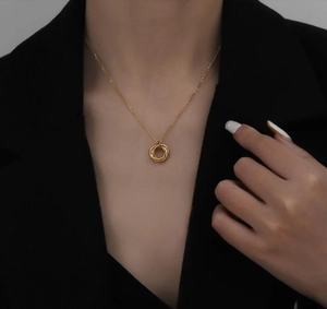Elegant 18K gold-plated interlocking triple ring pendant necklace on model