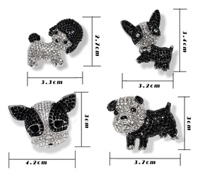 Detailed view of four crystal dog brooches with precise size measurements in centimeters
