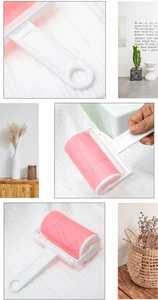 Detail of pink washable lint roller showing adhesive drum and ergonomic non-slip handle
