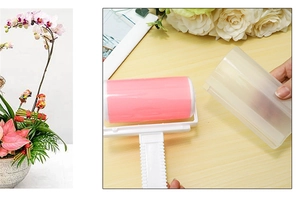 Pink washable lint roller with a transparent protective cover and white ergonomic handle