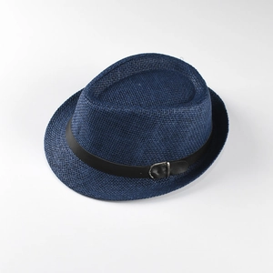 Close-up of the woven texture and black belt detail on a navy blue straw jazz hat
