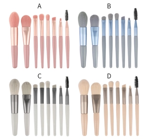 Detail view of 8-piece mini makeup brush sets in pink, blue, white, and beige colors