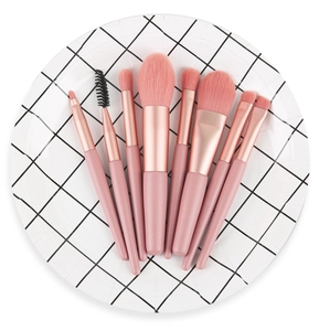 Pink makeup brush set with rose gold ferrules and soft bristles for travel