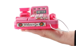 Pink toy cash register with calculator keys and scanner, handheld to show compact size