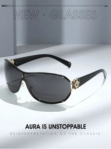 Detail of oversized sunglasses featuring golden metal temples with black camellia floral accents