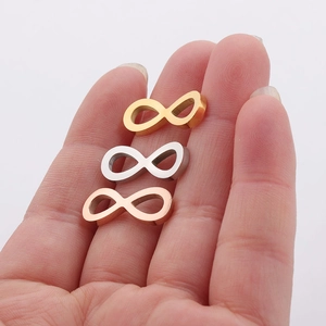 Polished stainless steel infinity symbol pendants in gold, silver, and rose gold finishes