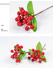 Detailed view of artificial red berries with green leaves for Christmas home decoration