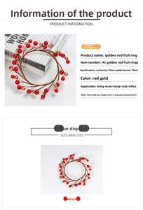 Macro detail of artificial red and gold 10mm berries wreath for home Christmas decor