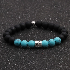 Detail of Sagittarius beaded bracelet with matte black stones and turquoise beads