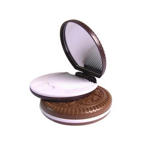Detail view of the brown chocolate cookie folding mirror set with white inner comb