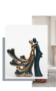 Detail of Morandi dark green ceramic couple sculpture with elegant gold electroplating finish