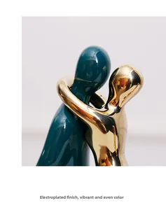 Close-up of modern ceramic sculpture featuring bright gold plating and deep green glaze