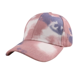 Detailed close-up of pink and purple tie-dye cotton baseball cap with curved brim and stitching