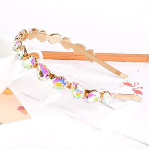 Close-up of golden alloy headband with sparkling teardrop-shaped AB color crystals