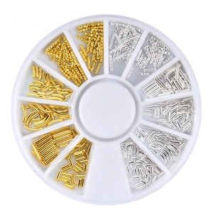 Golden and silver nail art spiral metal rivets set in a 12-slot rotary storage wheel case