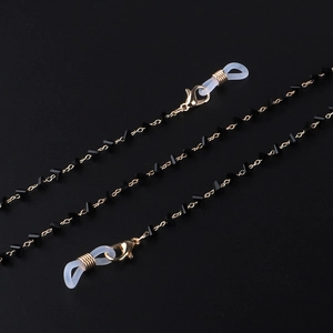 Gold eyewear chain with black triangle crystals and non-slip silicone loops