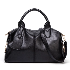 Classic black lychee pattern leather Boston handbag with gold hardware on white background