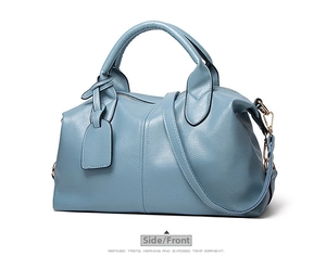 Side view of blue lychee grain boston handbag with detachable shoulder strap and handles