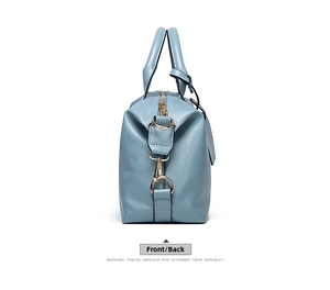 Side view of blue lychee grain handbag showing metal zipper and side hook details