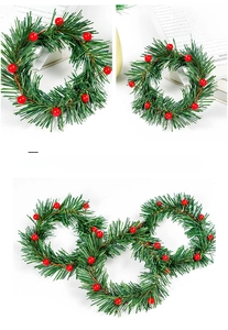Detailed view of flexible pine needle wreath with red berries and adjustable wire core