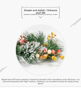 Detail of PVC pine needles and red berries with snow texture for Christmas decor
