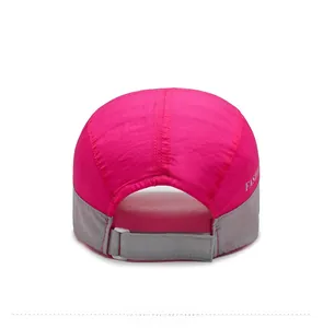 Detail view of the rose red quick-dry hat back with adjustable gray hook and loop strap
