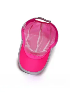 Internal view showing breathable white mesh lining and size label of pink sports sun hat