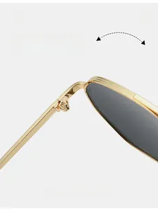 Macro shot of durable metal hinges with anti-slip texture on gold polarized sunglasses