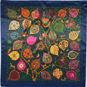 Detailed pattern of the silk scarf featuring tree of life and colorful animal motifs