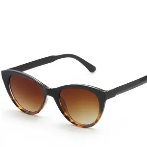 Retro cat-eye sunglasses with black tortoiseshell frame and brown gradient lenses