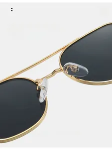 Close-up of comfortable silicone nose pads on premium gold metal polarized sunglasses